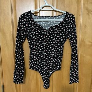 Black Onesie with Pink & White Floral. Size XS